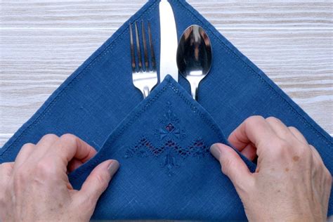 napkin folding with silverware|napkin folding with cutlery inside.